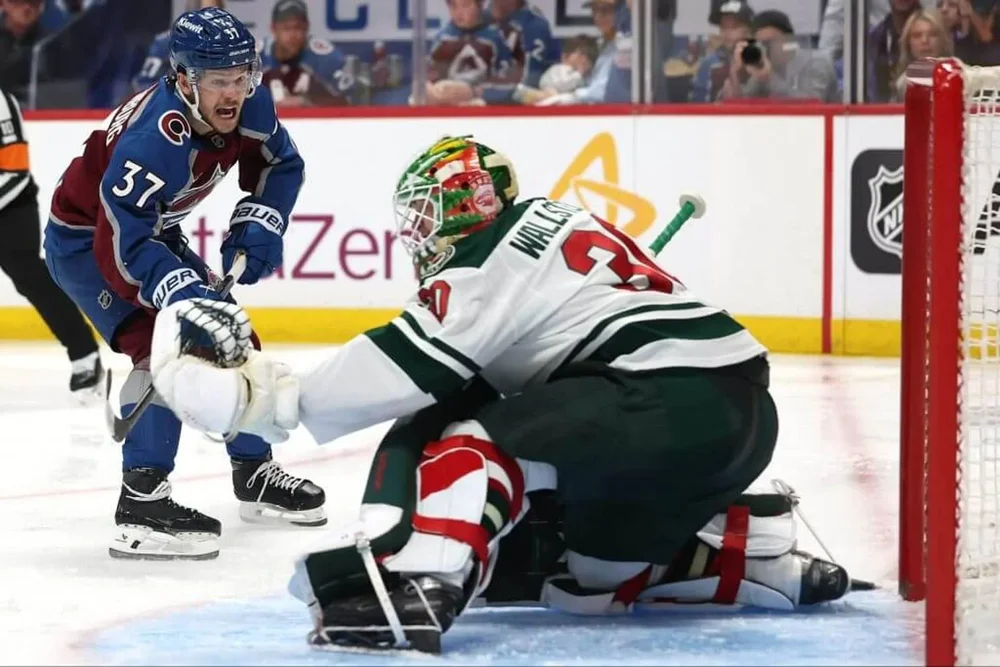 Nick Blankenburg of the Colorado Avalanche scores a goal past Jesper Wallstedt of the Minnesota Wild during the second period in Game 1.